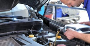 mechanic changing oil